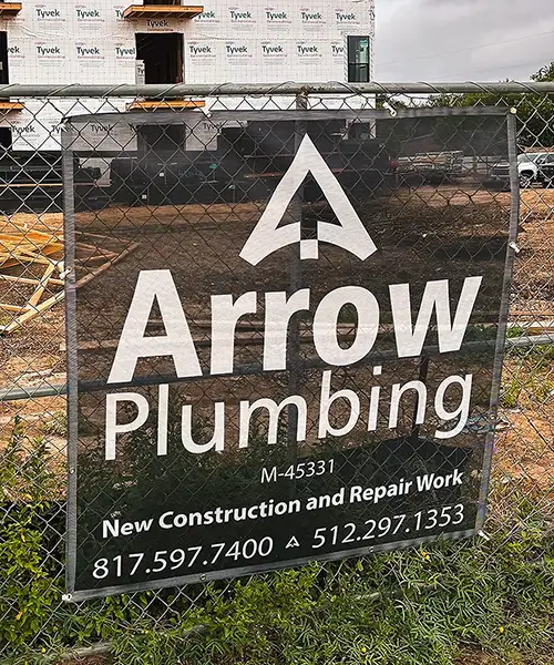 Arrow Plumbing job site sign on active commercial construction project